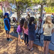 Spontaneous master class for a young trumpet player and her friends