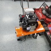a row of lawn mowers