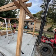 a man working on a wooden structure