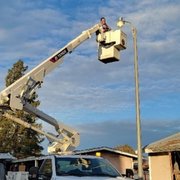 Todd in the 45' working height bucket truck, fixing a light
