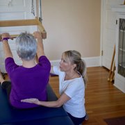 Trainer gives touch cues to help the client complete the exercise, recruiting the target muscles for optimal alignment & strength.