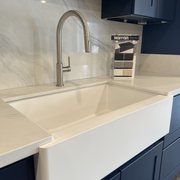 Karran faucet with an apron front sink.