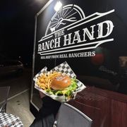 a person holding a plate of food