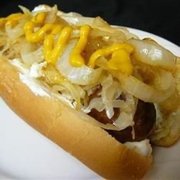 a hot dog with sauerkraut and onions