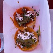 One steak one chicken taco with grilled pepper on each. Delicious