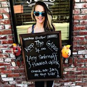 a woman holding a sign