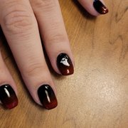 Kim and Ken did my nails for Spooky Season. She hand painted my little ghosts and they're so cute.