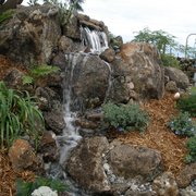 a waterfall in a rock garden
