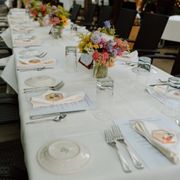 a long table set with place settings