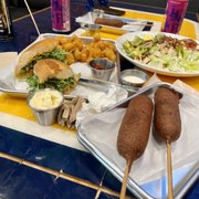Hand dipped corn dogs, surf and turf sando, and cob salad. Yummy!