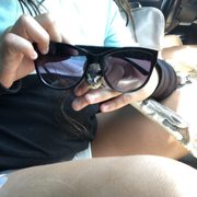 a small bird in her sunglasses