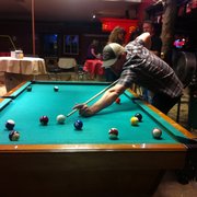 enjoying a game of pool on a sunday night