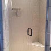 New frameless shower door, swings in or out, easy to clean. No more corners or places for mold to start or clean.