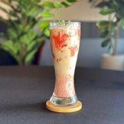 a drink in a tall glass