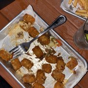 a tray of chicken nuggies and fries