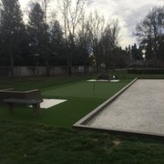 Composite bocce ball court, composite horse shoe pits, and putting green