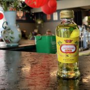 a bottle of olive oil on a counter
