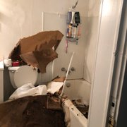 a bathroom that has been torn apart