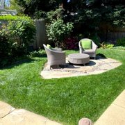 a patio with a fire pit