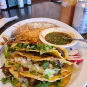 Tacos birria and consomme with rice and beans.
