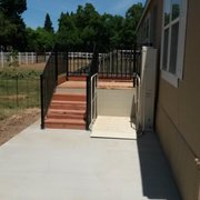 Vertical porch lift with stairs and landing