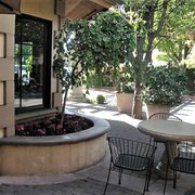Some of its outside seating areas have as much personality as the inside of this coffeehouse.