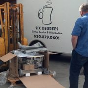 A brand new espresso machine fresh out of the box ready to be delivered and ready to make some delicious espresso!