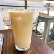 a glass of coffee on a table