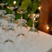 a row of wine glasses on a table