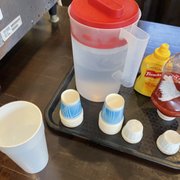 Smallest water cups next to a small cup