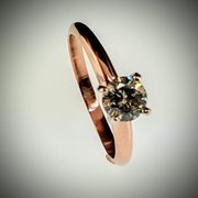 Rose gold and diamond solitaire ring