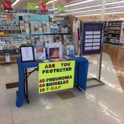 a table with a sign that reads are you protected?
