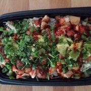 Chicken burrito bowl with avocado (no extra charge), pico de gallo, cabbage, cilantro and hot sauce. Very filling and delicious.