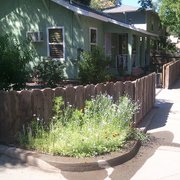 I landscaped this yard and built a small raised bed vegetable garden.