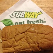 a sandwich on a table with a napkin