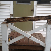Dry rot BEFORE:  Dry rot has destroyed this porch and railing, making it structurally unsound and unsafe.