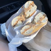 a bagel sandwich in a paper bag
