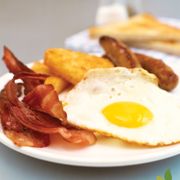a plate of bacon, eggs and toast